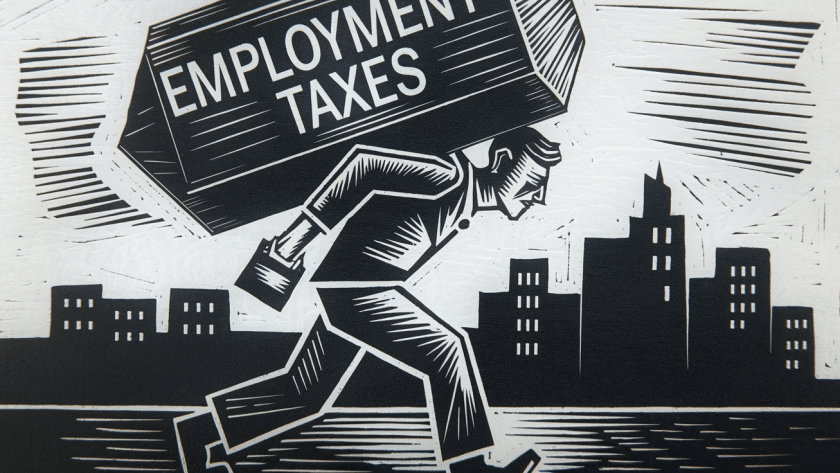 A small business owner carrying a heavy load of employment taxes.